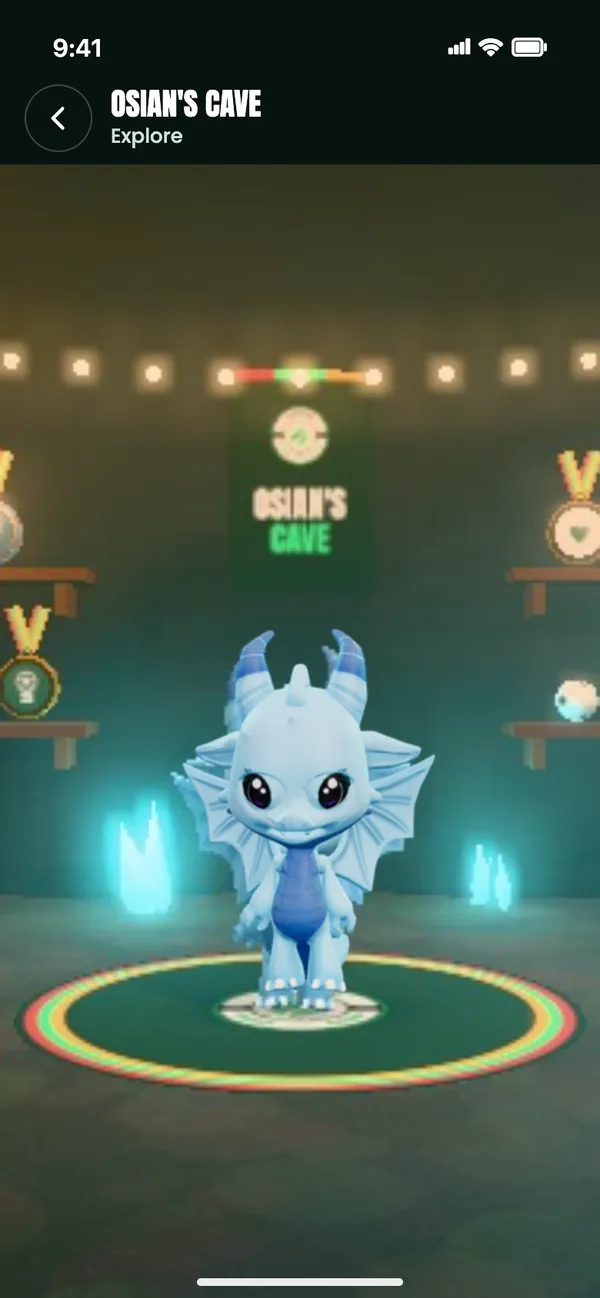 Explore: Osian’s dragon on the stage in his cave, with medals on the shelves behind it.